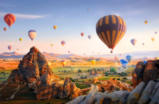 hot-air-balloons-flying-at-sunset-cappadocia-turkey-picture-id1164258121.jpg